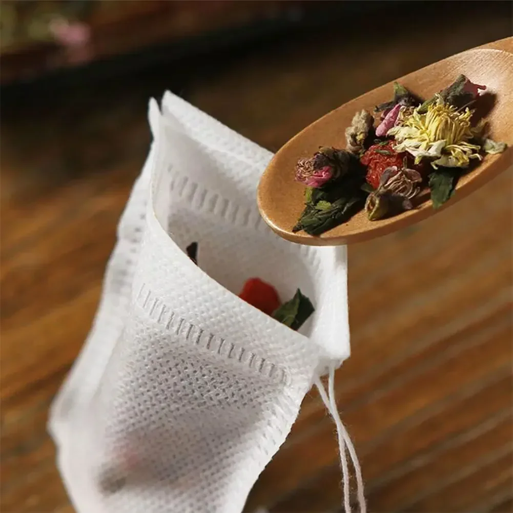 100Pcs еднократни чаени торбички нетъкан текстил чай подправка билков прах филтър чанта низ запечатване супа крак баня парфюм чанти